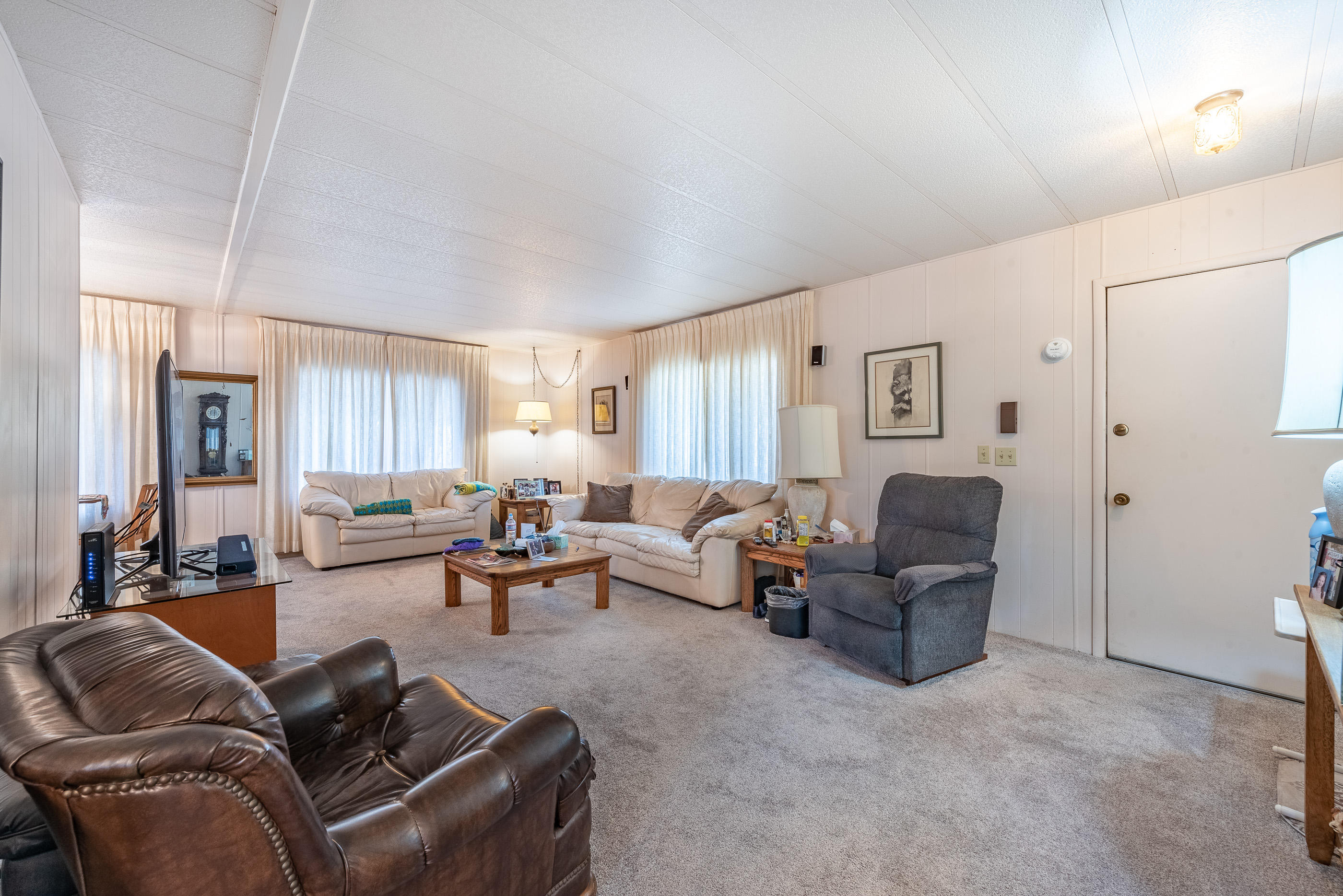 3950 Via Real, Unit 129 Carpinteria, CA 93013 - Photo 9 of 35 a living room with furniture and a window