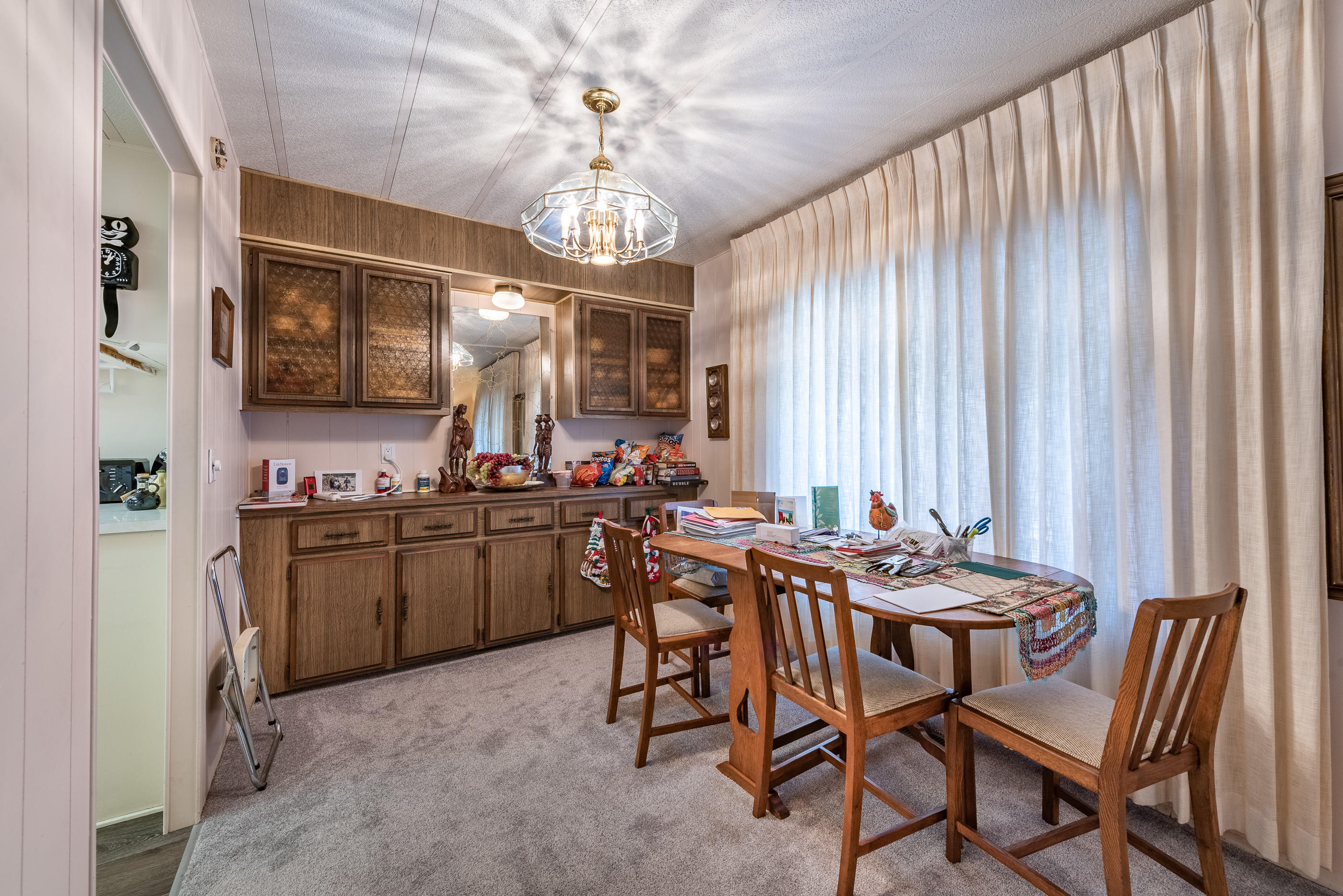 3950 Via Real, Unit 129 Carpinteria, CA 93013 - Photo 10 of 35 a view of a dining room with furniture window and chandelier