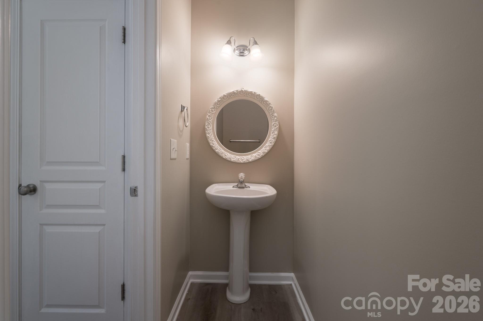 643 Brickdust Court Fort Mill, SC 29708 - Photo 13 of 28 a bathroom with a sink a toilet and a mirror