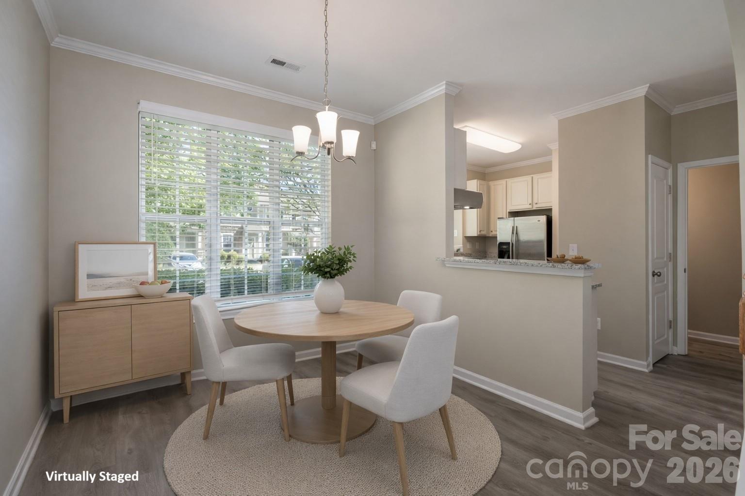 643 Brickdust Court Fort Mill, SC 29708 - Photo 7 of 28 a view of a dining room with furniture window and wooden floor