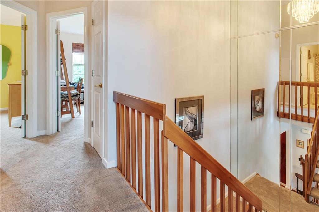 210 Grace Street McKees Rocks, PA 15136 - Photo 10 of 22 The staircase is accented with a mirrored wall.