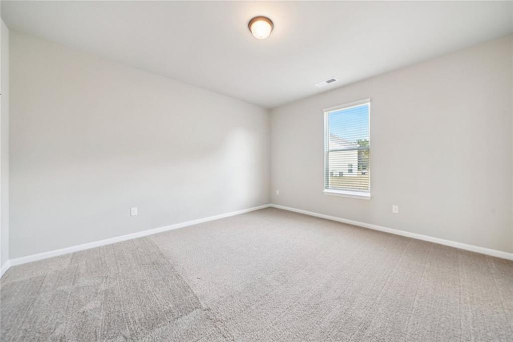 1547 Stinson Lane Locust Grove, GA 30248 - Photo 16 of 43 an empty room with windows
