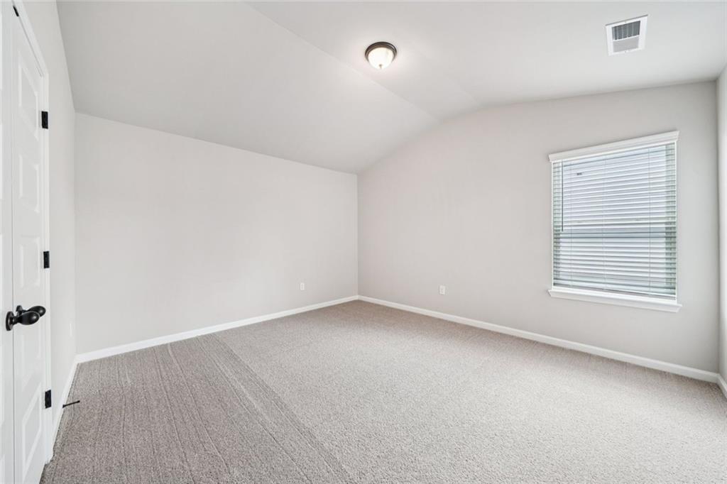 1547 Stinson Lane Locust Grove, GA 30248 - Photo 25 of 43 an empty room with a window