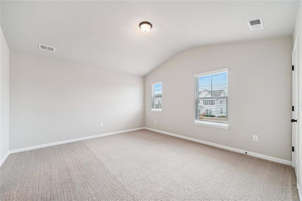 1547 Stinson Lane Locust Grove, GA 30248 - Photo 27 of 43 an empty room with a window