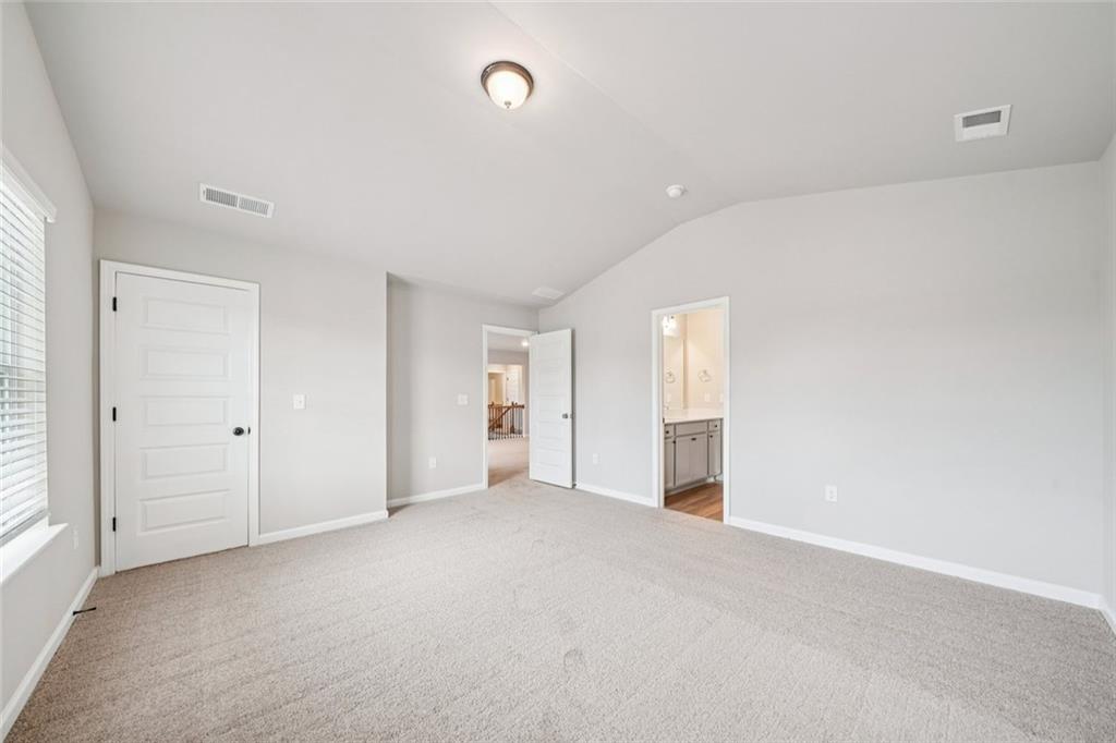 1547 Stinson Lane Locust Grove, GA 30248 - Photo 28 of 43 a view of an empty room with a window