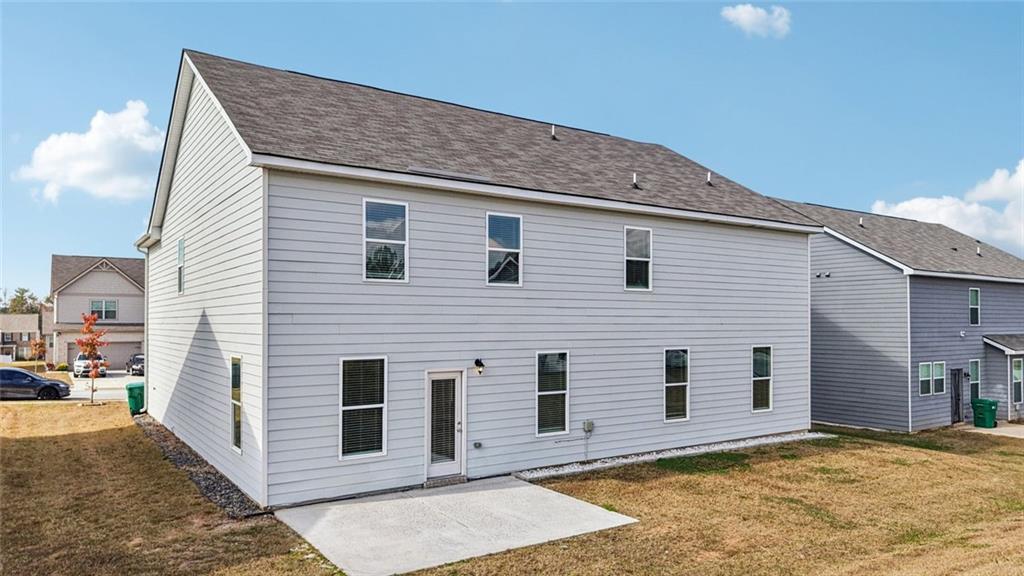 1547 Stinson Lane Locust Grove, GA 30248 - Photo 36 of 43 a view of a house with a backyard