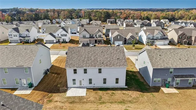 a front view of a house with parking space