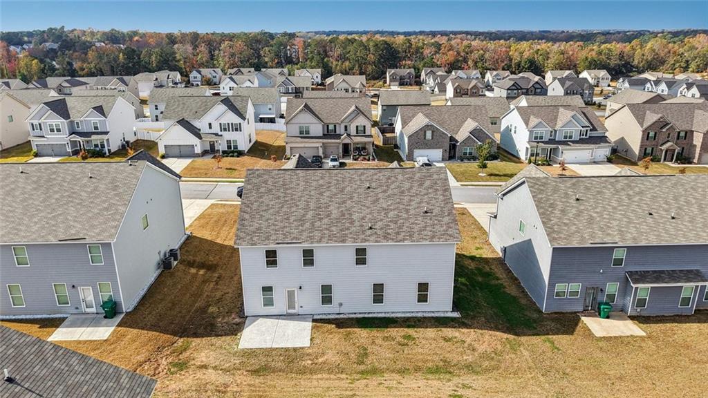 1547 Stinson Lane Locust Grove, GA 30248 - Photo 42 of 43 a view of a house with a yard