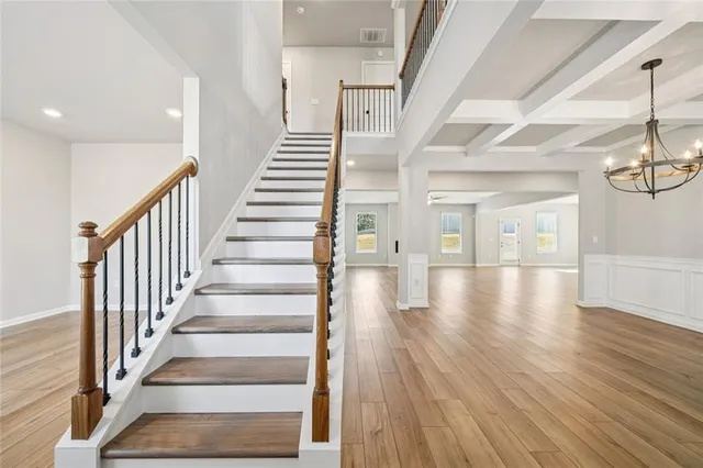 a view of an entryway with wooden floor