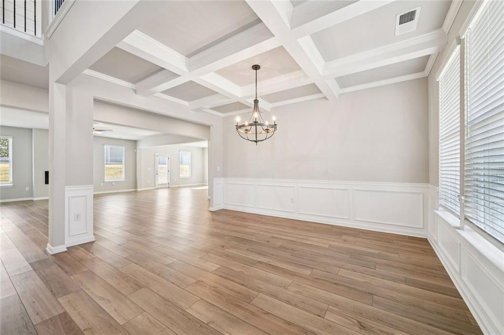 1547 Stinson Lane Locust Grove, GA 30248 - Photo 9 of 43 wooden floor in an empty room with a window