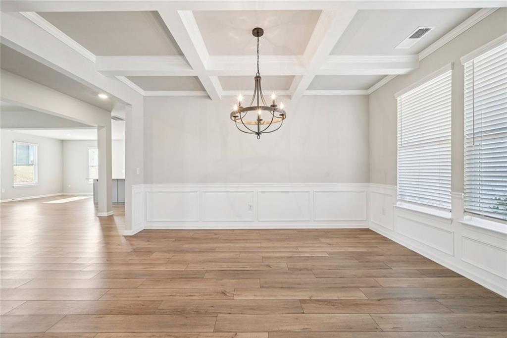 1547 Stinson Lane Locust Grove, GA 30248 - Photo 10 of 43 a view of empty room with wooden floor and window