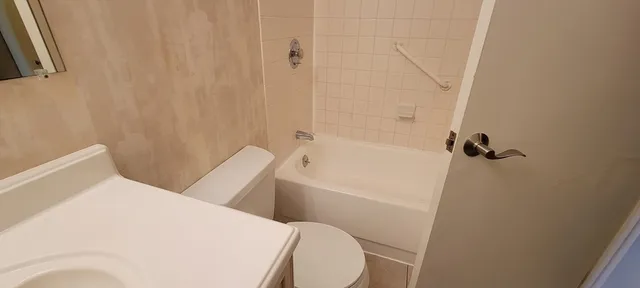 a bathroom with a bathtub and shower