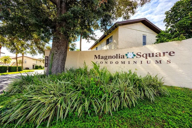 a view of a house with a yard and garden