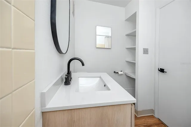 a close view of a sink and dishwasher in a bathroom