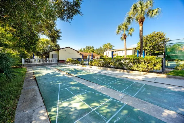 a view of yard with swimming pool and seating area
