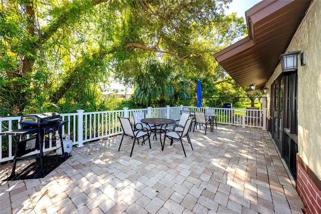 a view of a tables and chairs in patio