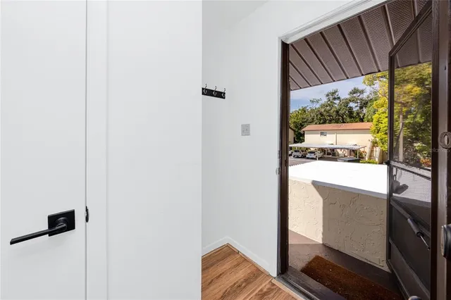 a view of a living room with a floor to ceiling window