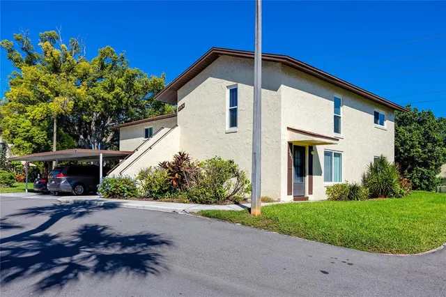 a view of a house with a yard and garage