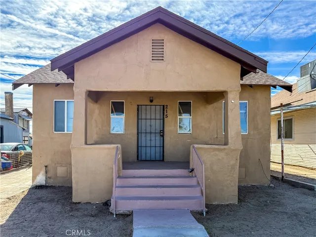 a front view of a house with a porch