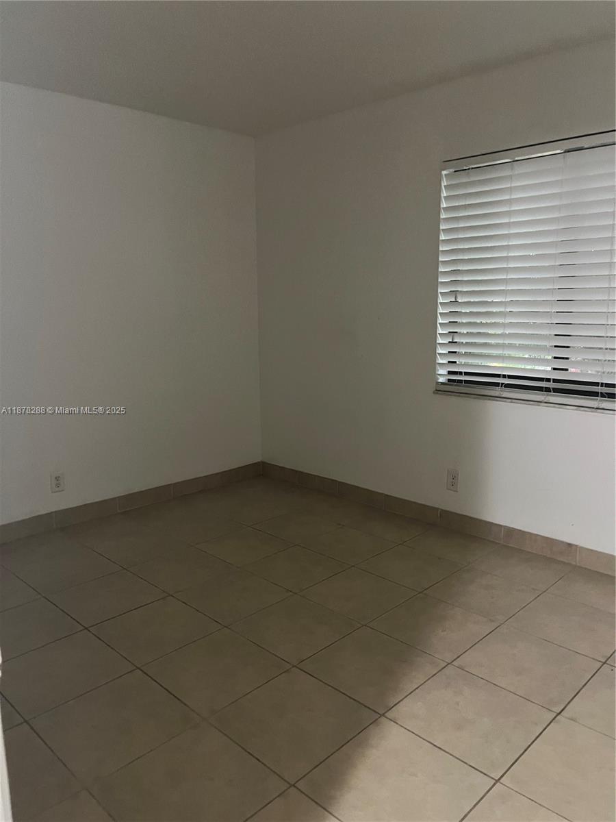 3720 North Pine Island Road, Unit 331 Sunrise, FL 33351 - Photo 12 of 22 an empty room with a window