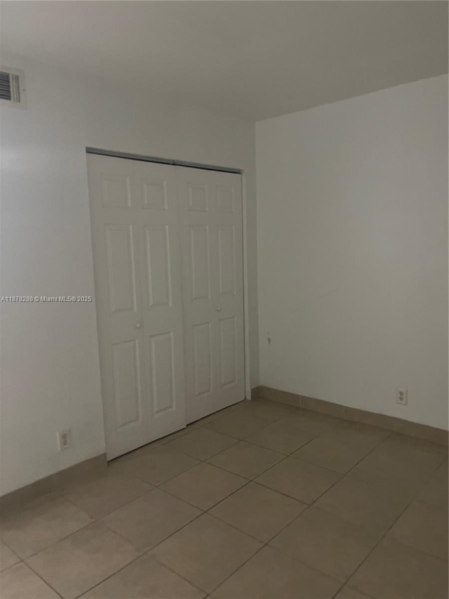 3720 North Pine Island Road, Unit 331 Sunrise, FL 33351 - Photo 13 of 22 an empty room with an entryway