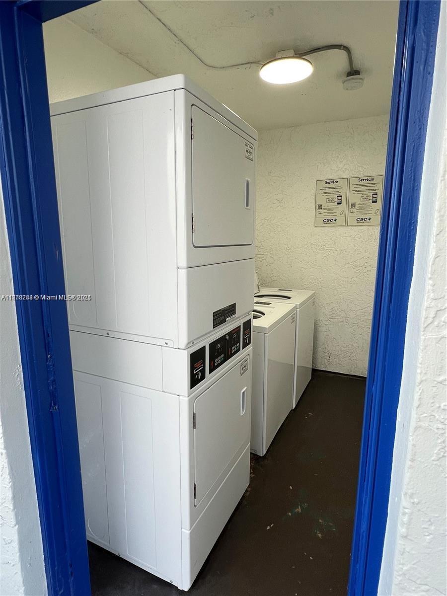 3720 North Pine Island Road, Unit 331 Sunrise, FL 33351 - Photo 17 of 22 a utility room with dryer and washer