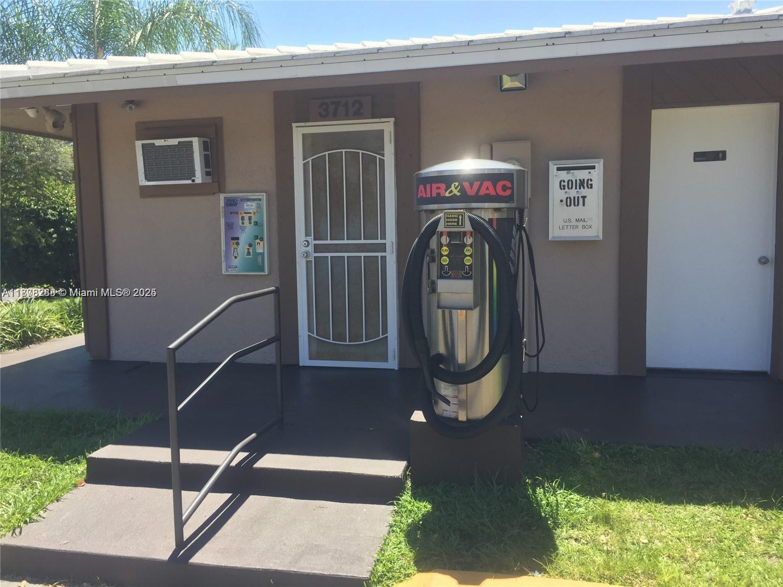 3720 North Pine Island Road, Unit 331 Sunrise, FL 33351 - Photo 20 of 22 a front view of a house with garden
