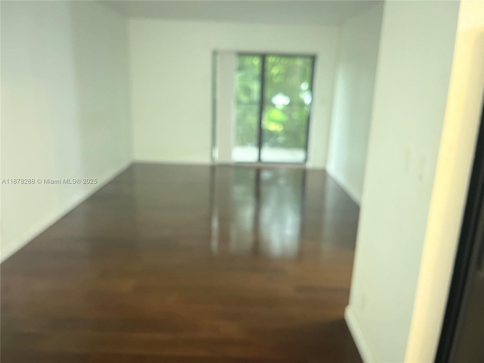 3720 North Pine Island Road, Unit 331 Sunrise, FL 33351 - Photo 3 of 22 a view of water heater room with wooden floor