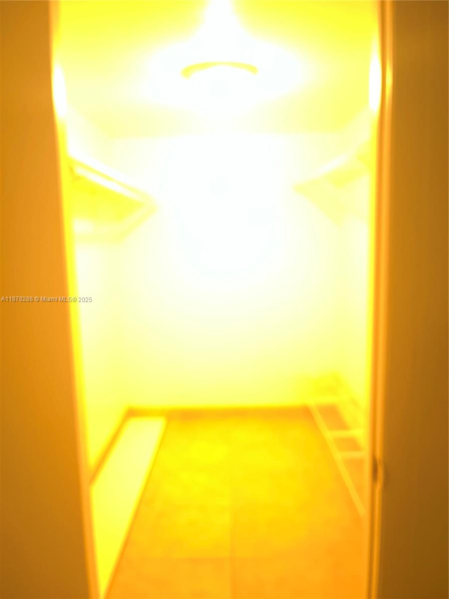 3720 North Pine Island Road, Unit 331 Sunrise, FL 33351 - Photo 6 of 22 a view of beach and blue painted wall