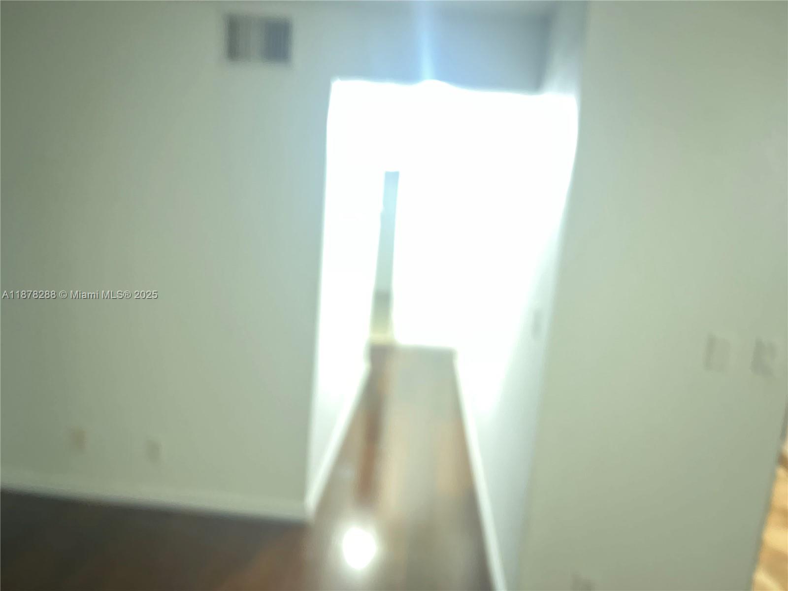 3720 North Pine Island Road, Unit 331 Sunrise, FL 33351 - Photo 8 of 22 a view of a hallway with wooden floor