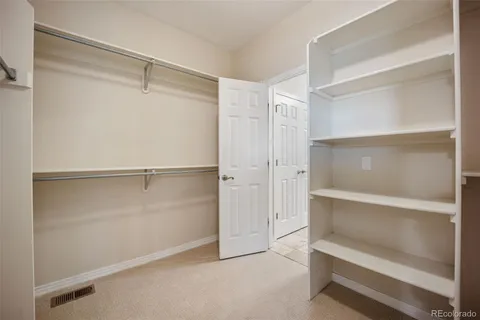 a view of an empty walk in closet