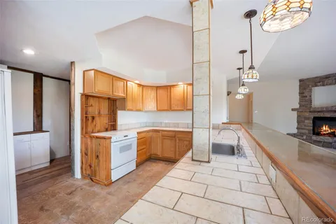 a kitchen with stainless steel appliances a stove a sink and a refrigerator