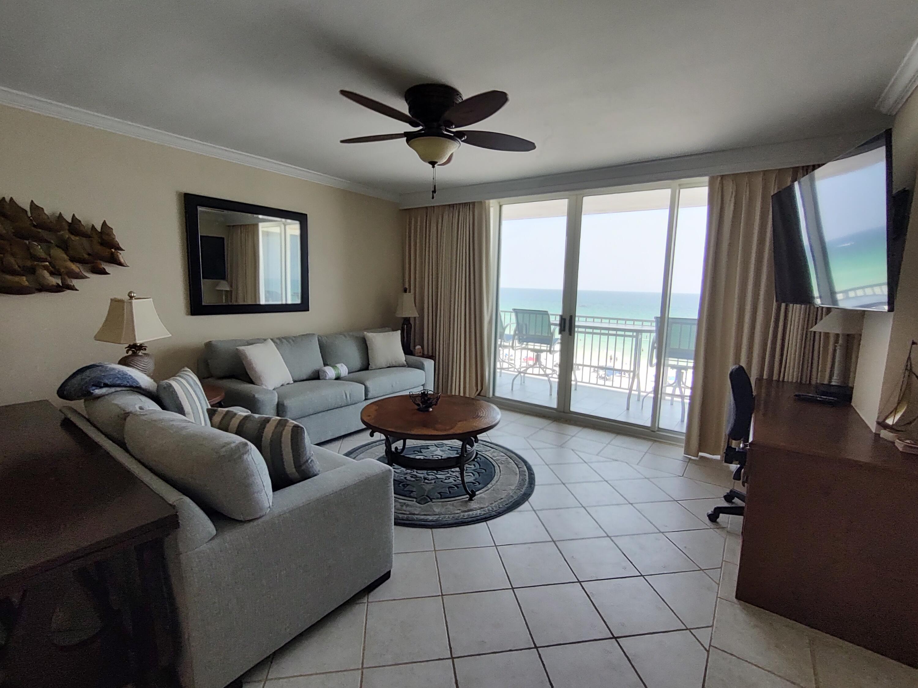 520 Santa Rosa Boulevard, Unit 605 Fort Walton Beach, FL 32548 - Photo 2 of 32 a living room with furniture and a flat screen tv