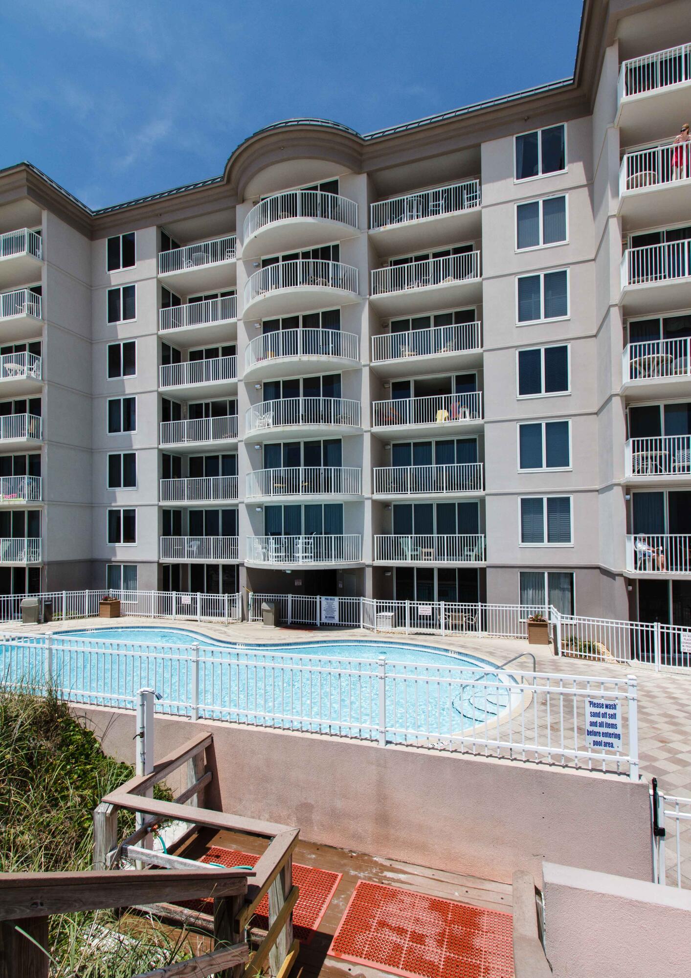 520 Santa Rosa Boulevard, Unit 605 Fort Walton Beach, FL 32548 - Photo 23 of 32 a front view of a building with a swimming pool