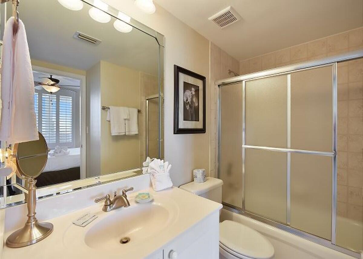 520 Santa Rosa Boulevard, Unit 605 Fort Walton Beach, FL 32548 - Photo 28 of 32 a bathroom with a sink toilet and shower