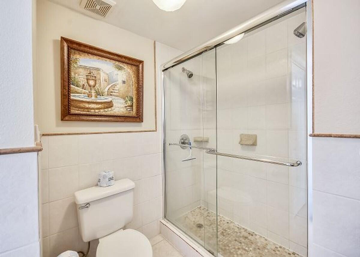520 Santa Rosa Boulevard, Unit 605 Fort Walton Beach, FL 32548 - Photo 30 of 32 a bathroom with a toilet and a shower