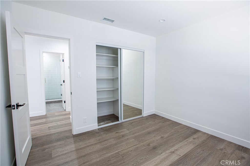 19503 Cantara Street Reseda, CA 91335 - Photo 12 of 19 a view of empty room with wooden floor