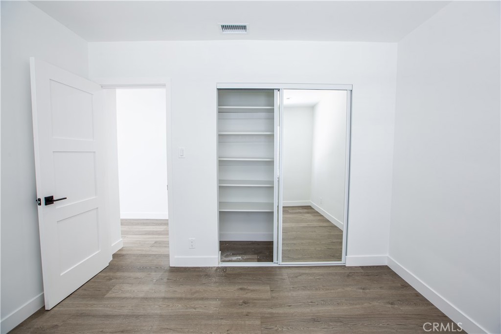 19503 Cantara Street Reseda, CA 91335 - Photo 15 of 19 a view of a room with wooden floor