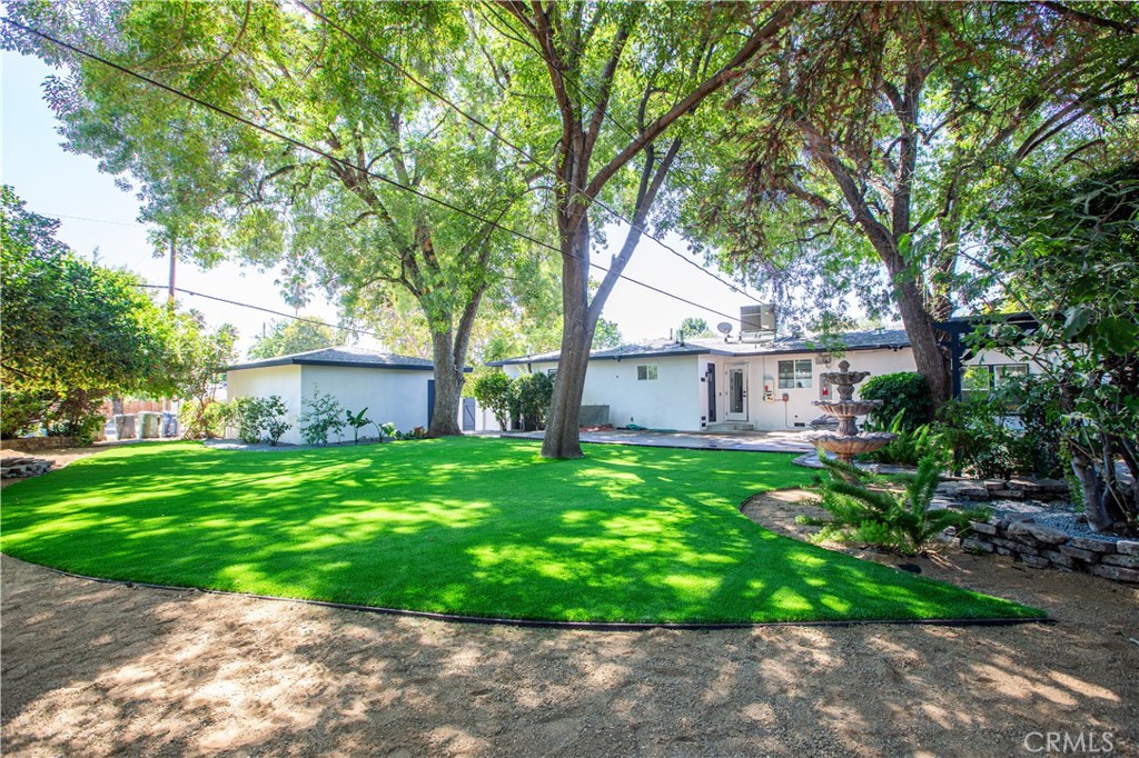 19503 Cantara Street Reseda, CA 91335 - Photo 16 of 19 a view of a house with backyard and garden