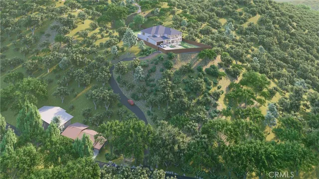 a aerial view of a house with a yard