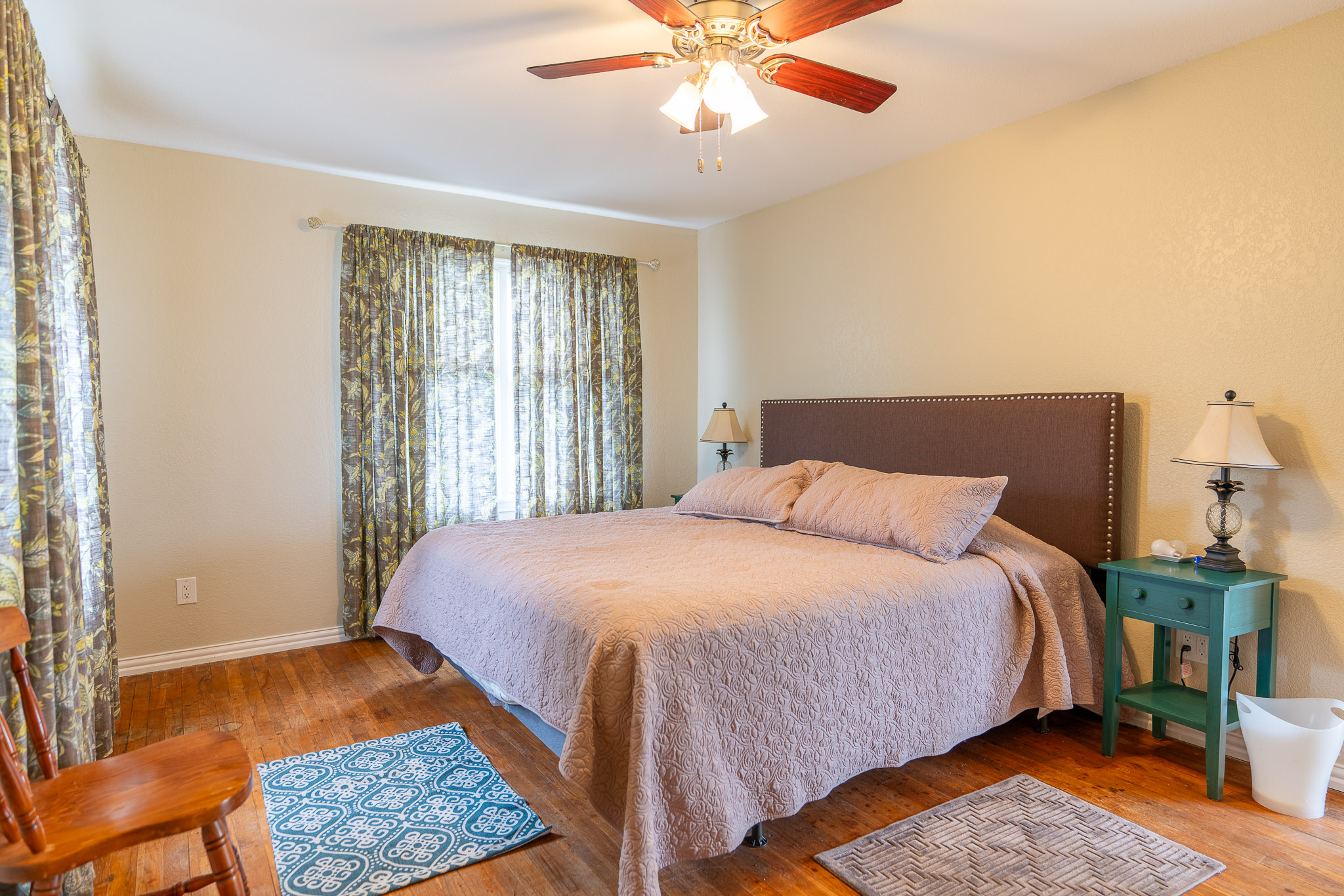 2145 County Road 320 Lohn, TX 76852 - Photo 6 of 40 Bedroom featuring hardwood / wood-style flooring and a ceiling fan