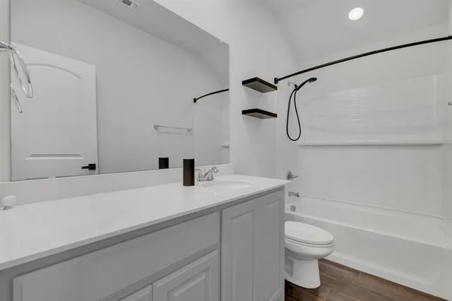 a bathroom with a sink a toilet and a bathtub