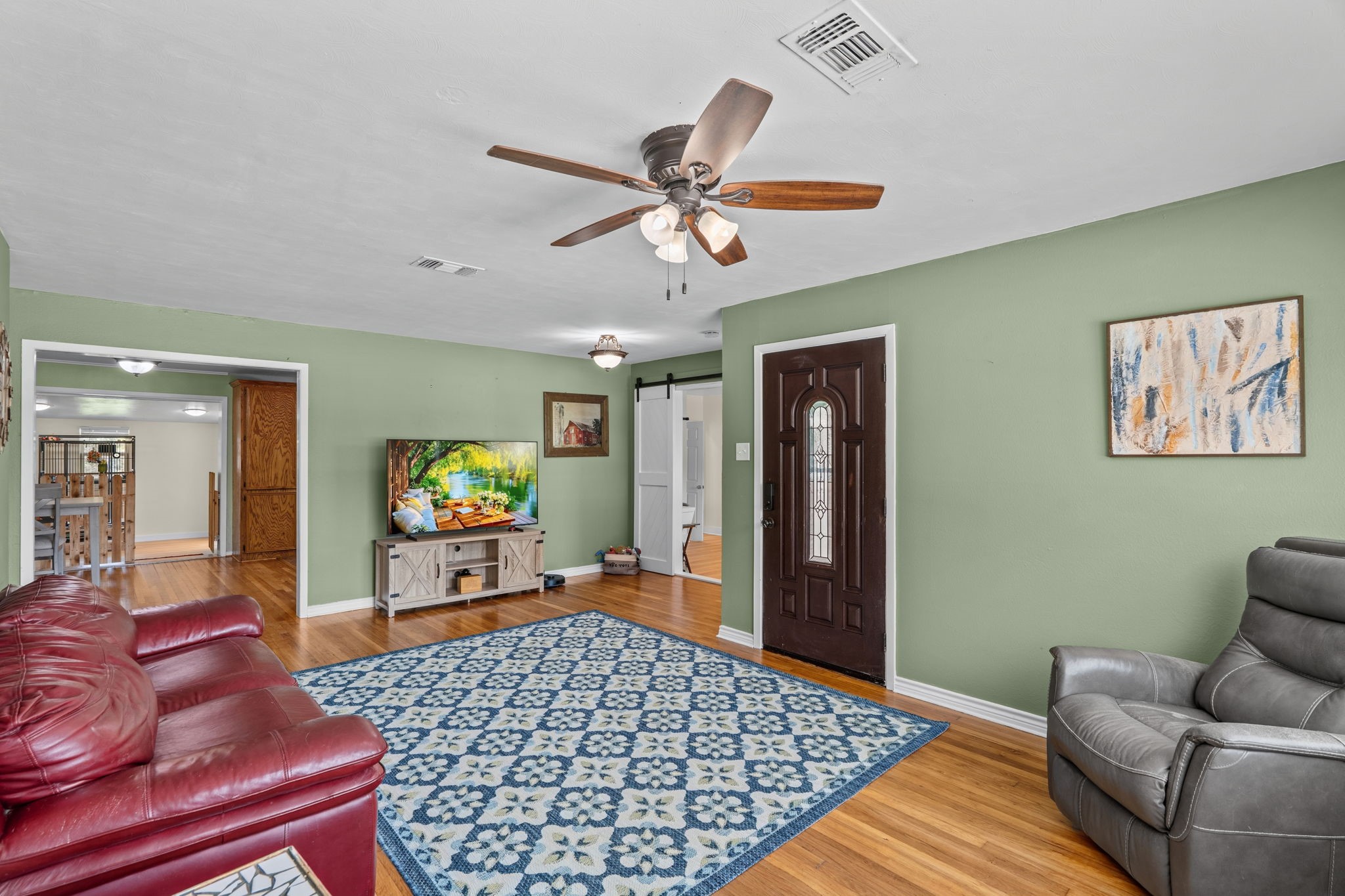 4630 Hudson Road Santa Fe, TX 77517 - Photo 8 of 44 a bedroom with furniture and a wooden floor