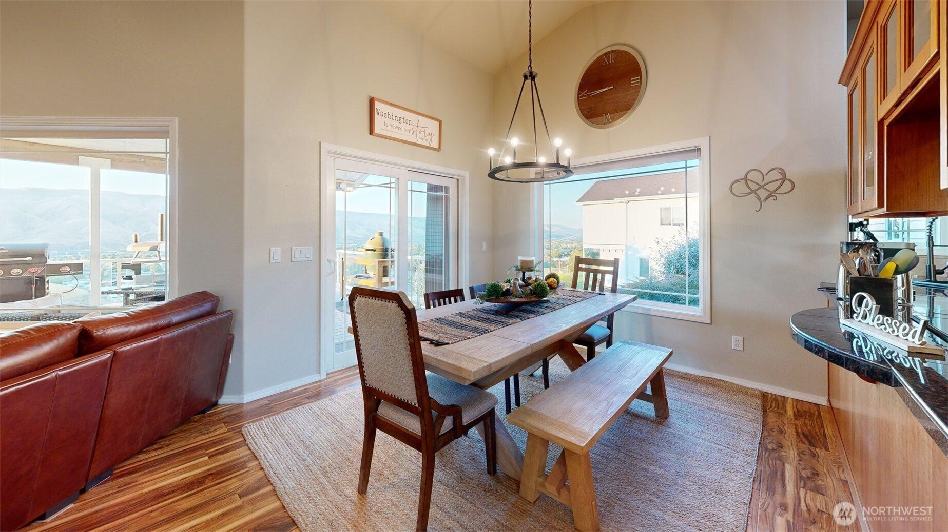 1724 Ridgeview Drive Clarkston, WA 99403 - Photo 34 of 38 a dining room with furniture a chandelier and wooden floor