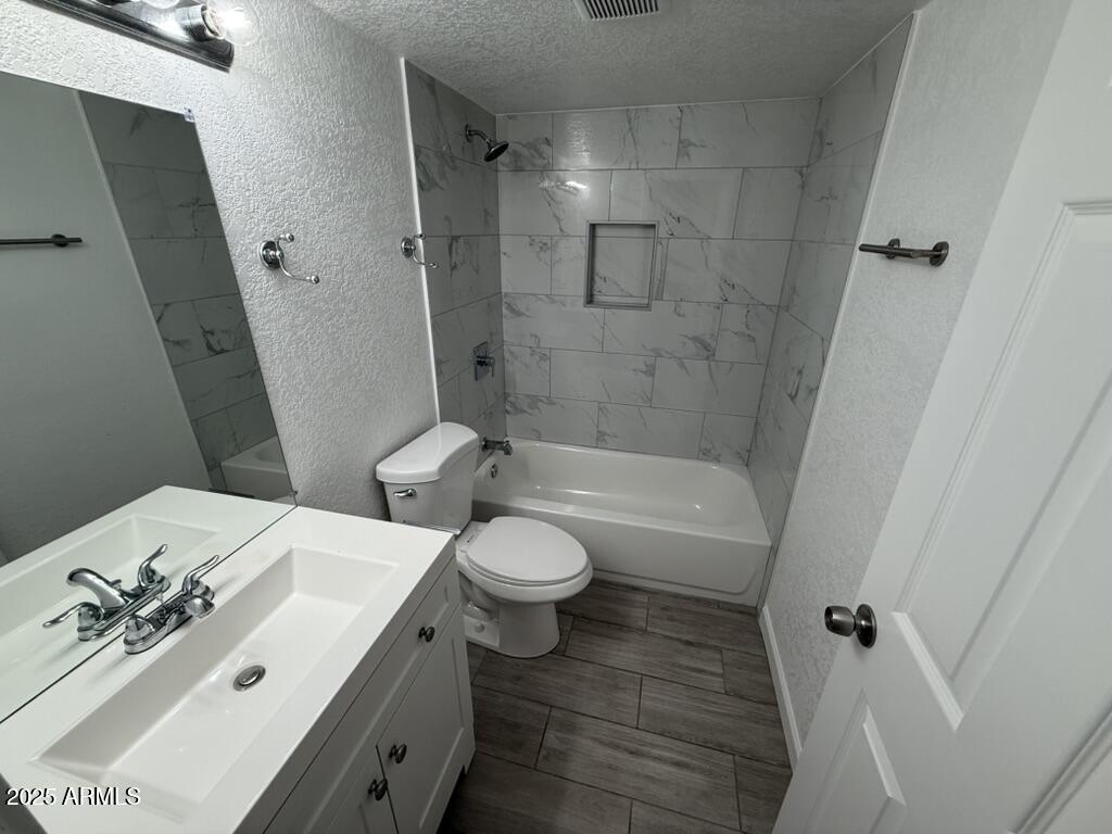 234 East Ruth Avenue, Unit 3 Phoenix, AZ 85020 - Photo 6 of 6 a bathroom with a sink a toilet and shower