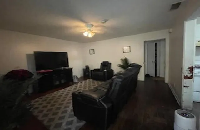 a bedroom with a bed and dresser