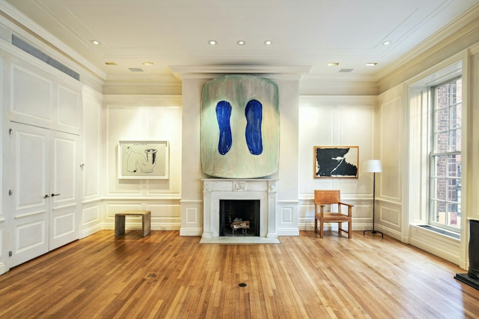 36 East 63rd Street Manhattan, NY 10065 - Photo 10 of 21 a living room with furniture and a fireplace