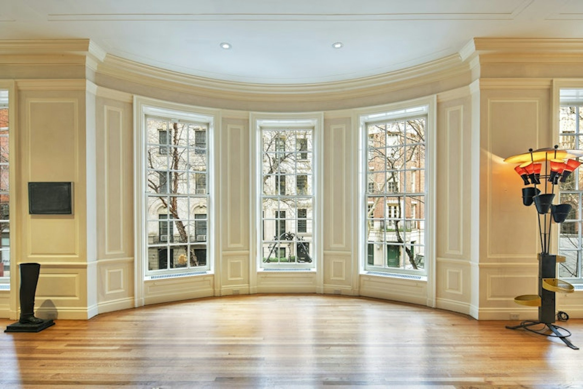 36 East 63rd Street Manhattan, NY 10065 - Photo 11 of 21 a view of an empty room with wooden floor and a window