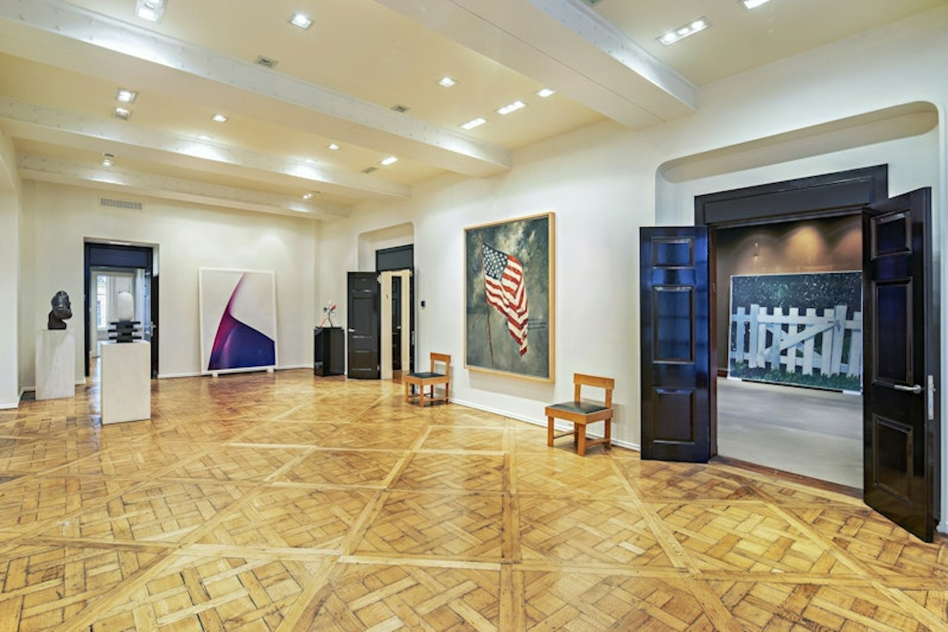 36 East 63rd Street Manhattan, NY 10065 - Photo 12 of 21 a view of an empty room with furniture and a fireplace