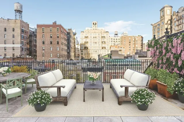 a bedroom with a bed a desk and chair with window